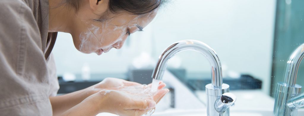 Woman using facewash